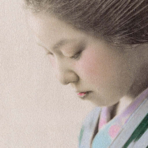 Detail of fine art print of a young Japanese woman in kimono reading a book, 1890s