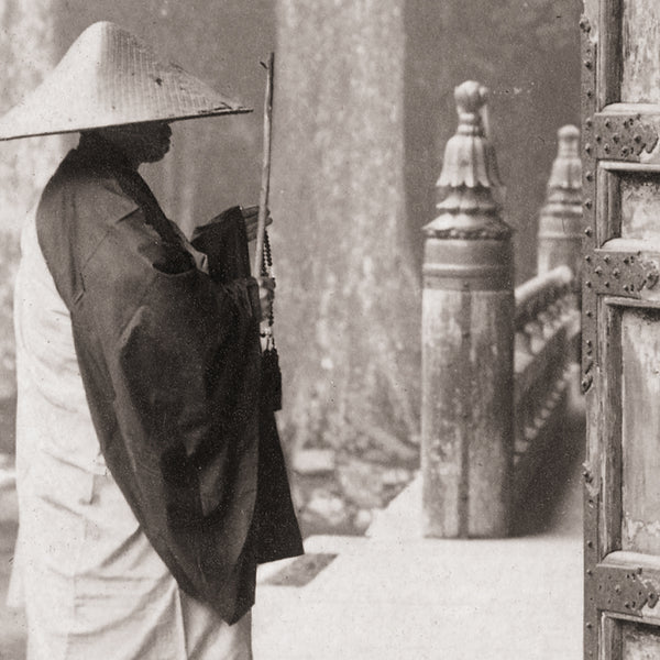Detail of a fine art print of a Buddhist monk praying at a temple
